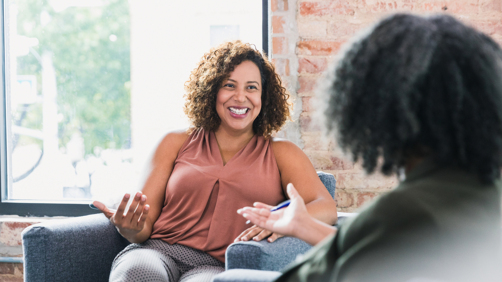 Two adults discussing something