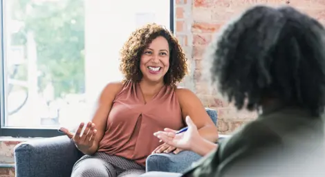 Two adults discussing something