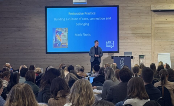 Presenting on stage at the event