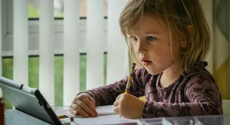 Child learning on a tablet