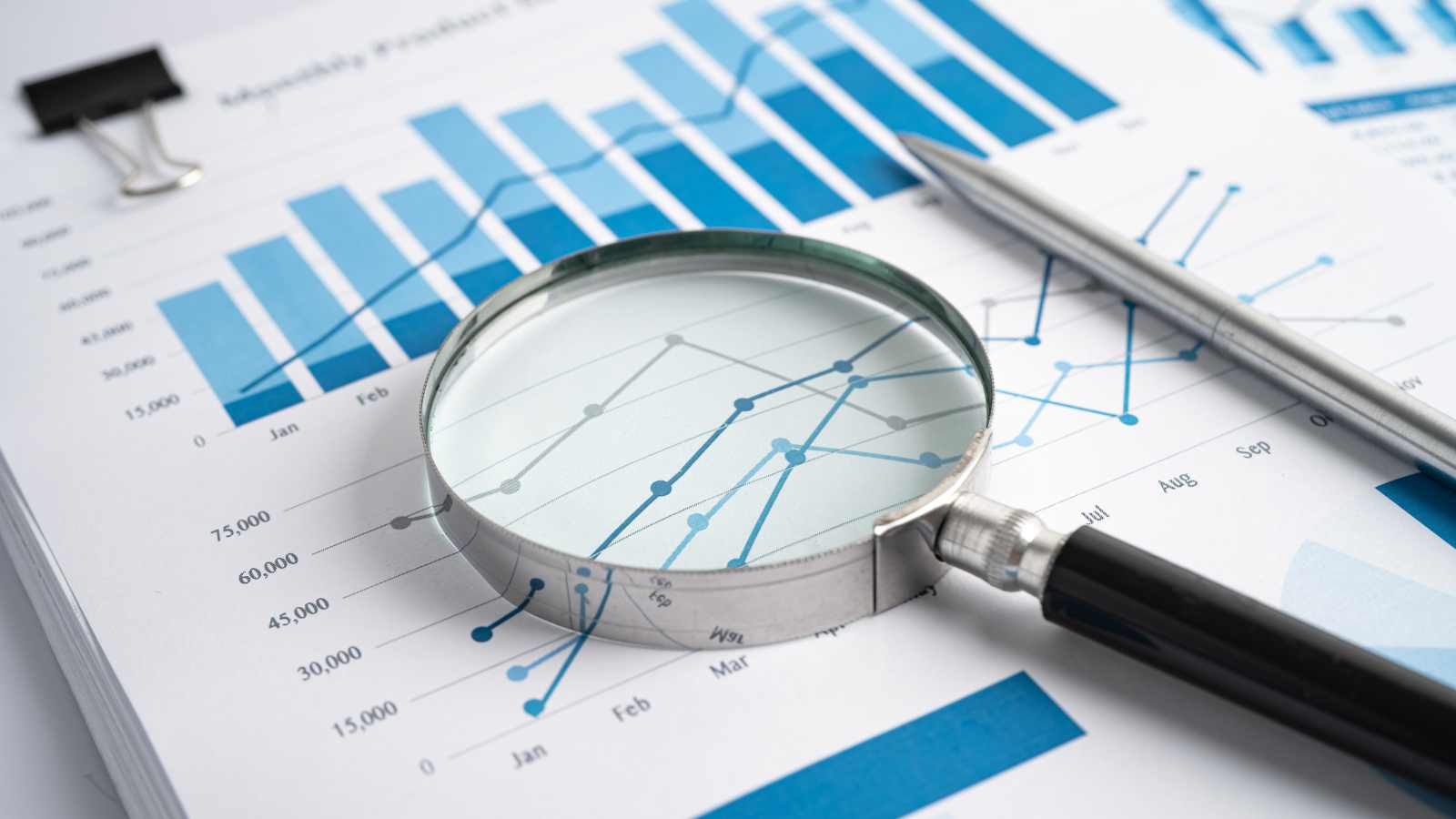 A magnifying glass on a report