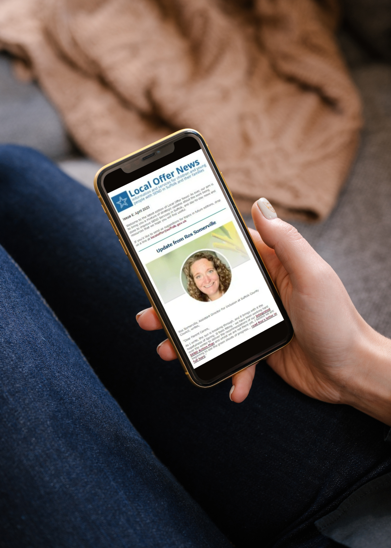 Someone reading a newsletter on a smartphone