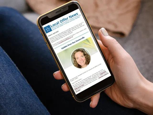 Someone reading a newsletter on a smartphone