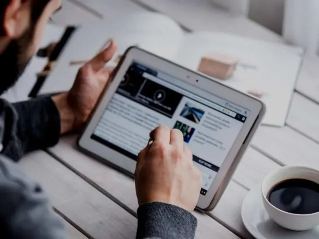 Someone reading on a tablet