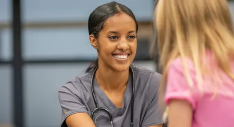 nurse working with young girl