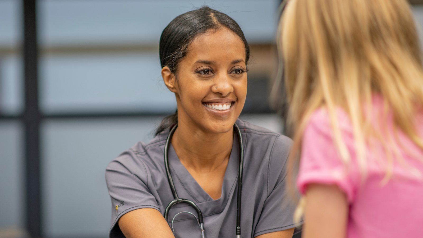 nurse working with young girl