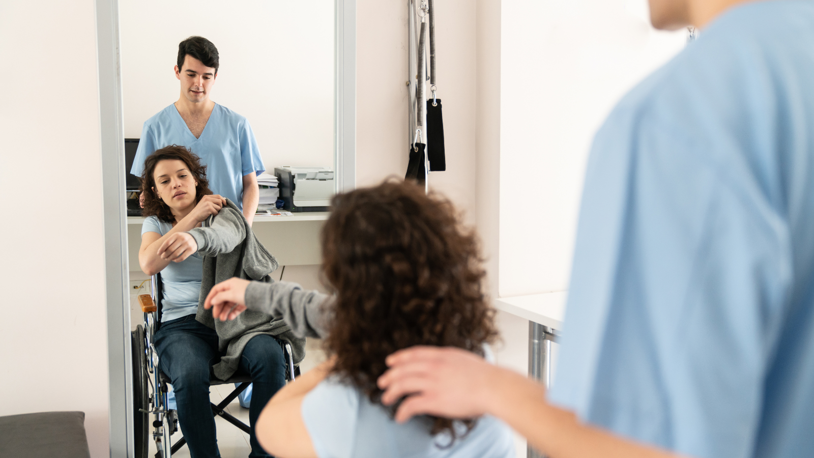patient in wheelchair with nurse