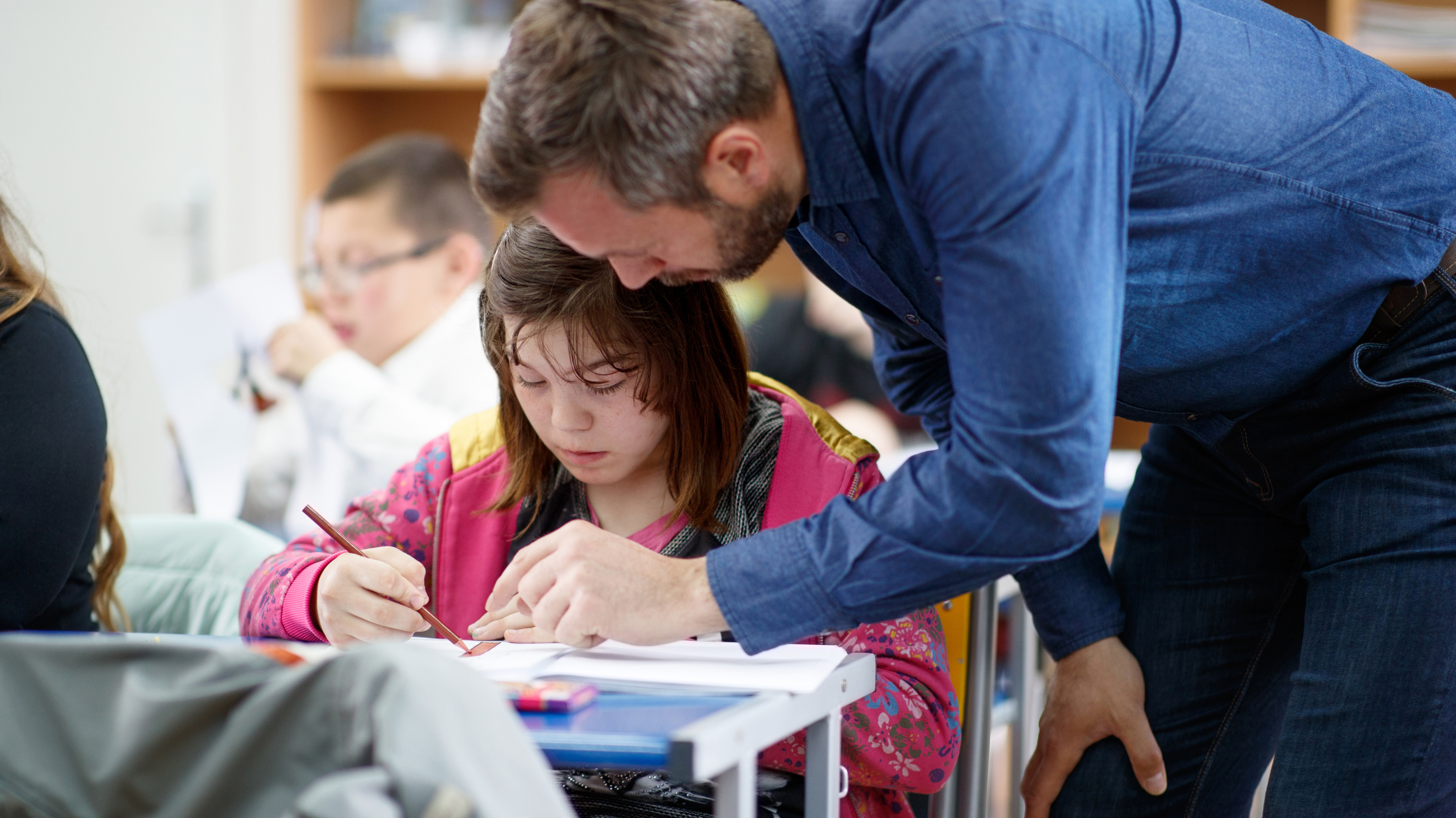 teacher helping child