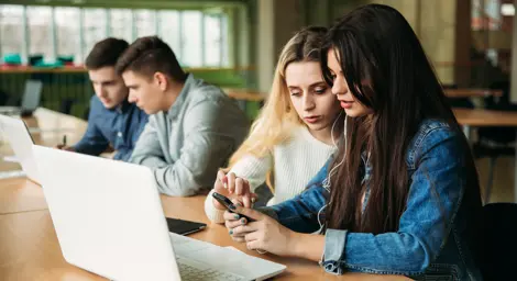 teenagers working on a laptop