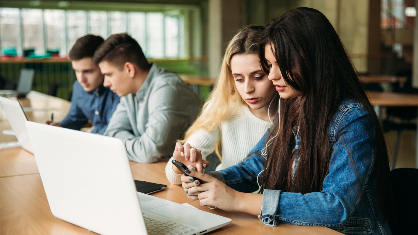teenagers working on a laptop