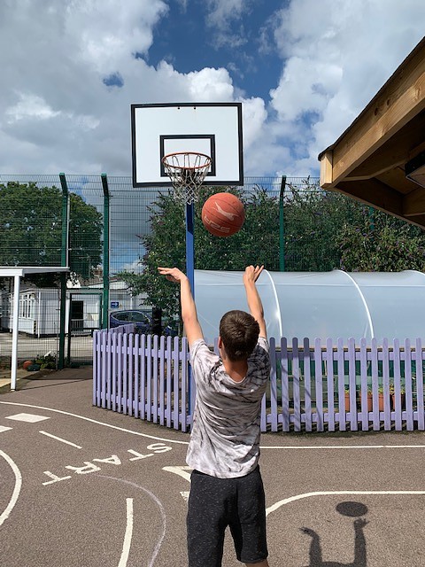 topcats child playing basketball