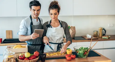 Two people cooking