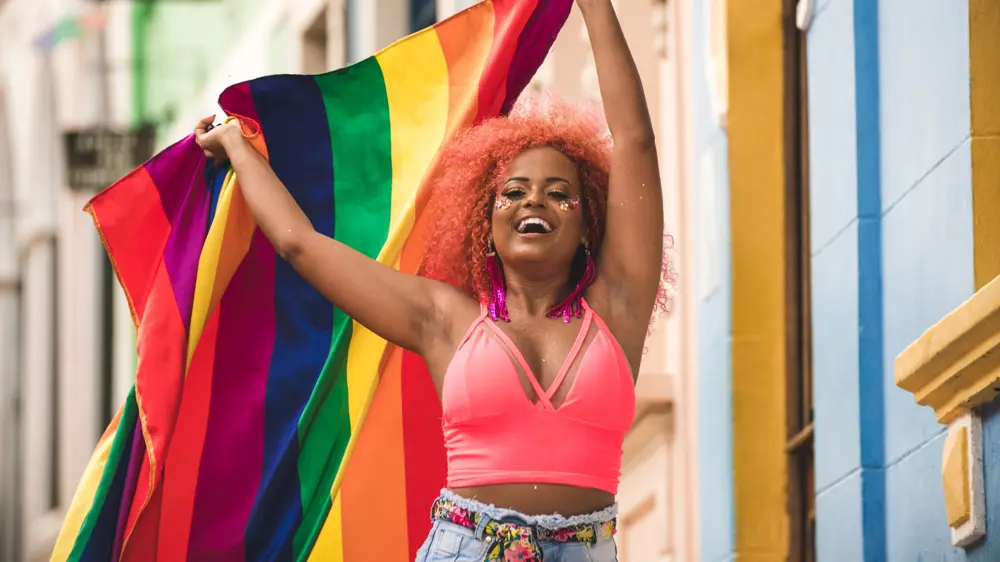Woman holding pride flag