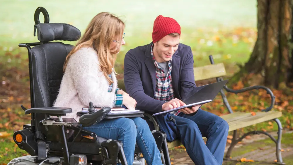 Woman in wheelchair and friend